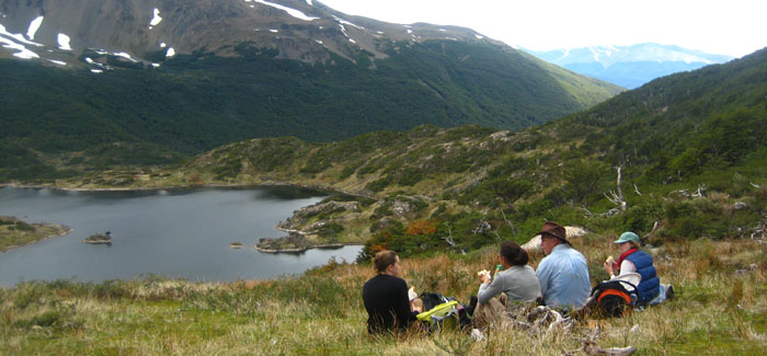 People sitting by some water